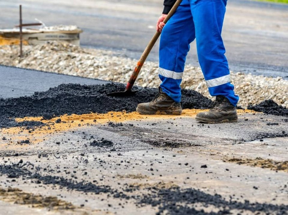man with tool in hand